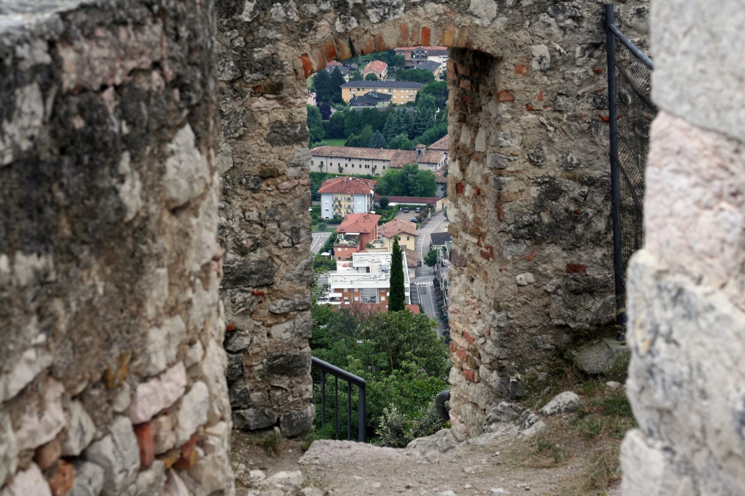 Through an old gate you can see the small town in the background