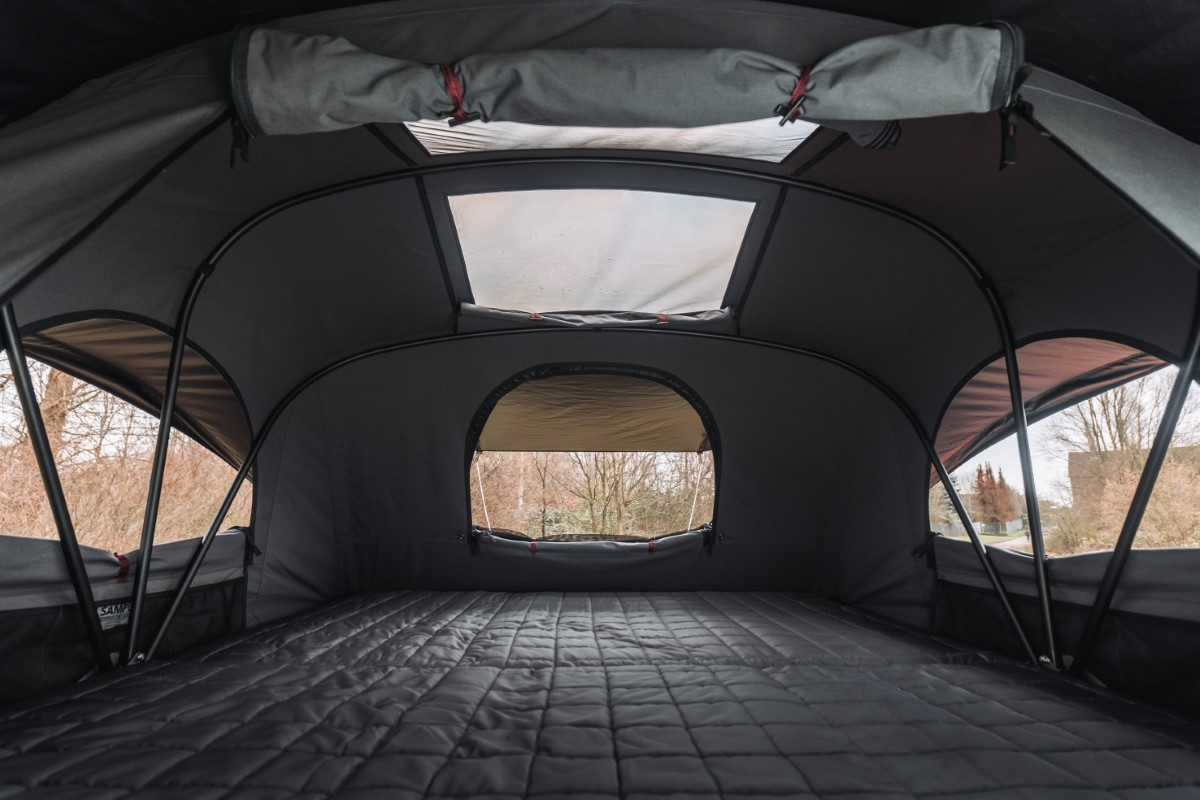 Interior of the X-Cover roof tent on a Mercedes Vito with a view of nature