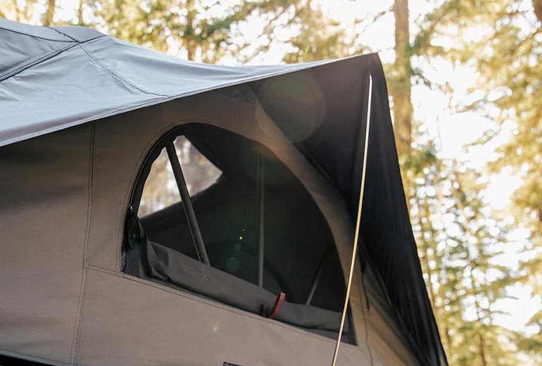 Covered windows. The new design features only one tension rod per window.
